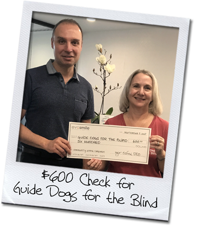 igor-carol Dr. Igor Ochev presents a $600 check to Guide Dogs for the Blind.