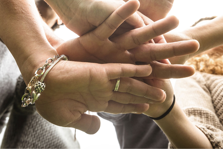 hands-stacked Our patient-first approach to dentistry starts with teamwork.